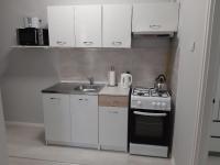 A kitchen or kitchenette at Jade Vendégház