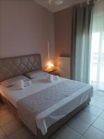 Postel nebo postele na pokoji v ubytování Dimitra Apartments