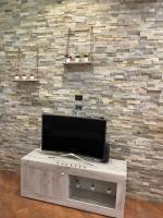 A television and/or entertainment centre at 34 Arena House