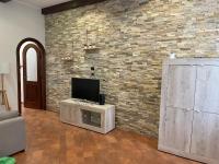 A television and/or entertainment centre at 34 Arena House