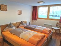 Postel nebo postele na pokoji v ubytování Chalet Enzian