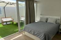 Postel nebo postele na pokoji v ubytování Solarium Beach House