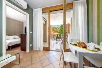 A bed or beds in a room at Residence Poggio Dei Pini