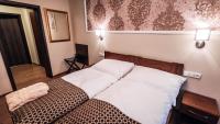 Postel nebo postele na pokoji v ubytování Star Hotel