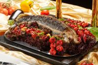 a large plate of food on a table at Beijing Hotel Minsk in Minsk