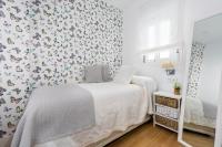 Postel nebo postele na pokoji v ubytování Genteel Home Juan Rabadán