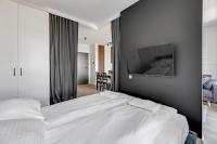 Łóżko lub łóżka w pokoju w obiekcie Grand Apartments Chlebova