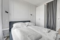 Łóżko lub łóżka w pokoju w obiekcie Grand Apartments Chlebova