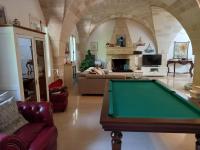 A seating area at MASSERIA INCANTAMENTO Suite Bouganville