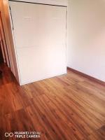 a sliding door in a room with a wooden floor at Superbe studio avec ascenseur à 50 mètres des cures et du centre ville in Vernet-les-Bains
