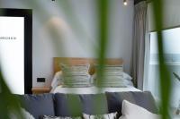 A bed or beds in a room at Suite Horizonte