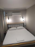 Posteľ alebo postele v izbe v ubytovaní Elaėa Boutique Apartments