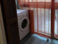 a washing machine in a room with a window at Kalliste - Appartement centre ville tout équipé in Bastia