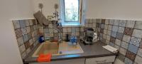 A kitchen or kitchenette at Kikötő Vendégház