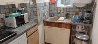 A kitchen or kitchenette at Kikötő Vendégház