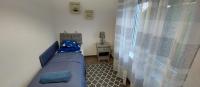 A bed or beds in a room at Kikötő Vendégház