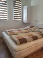 Posteľ alebo postele v izbe v ubytovaní Ivett apartmanház