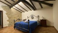 Łóżko lub łóżka w pokoju w obiekcie Agriturismo Il Casone