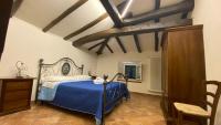 Łóżko lub łóżka w pokoju w obiekcie Agriturismo Il Casone