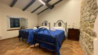 Łóżko lub łóżka w pokoju w obiekcie Agriturismo Il Casone