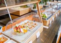a display case with a bowl of food on a table at APA Hotel Kanazawa Ekimae in Kanazawa