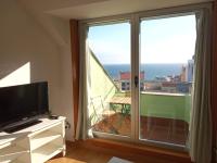 Televízia a/alebo spoločenská miestnosť v ubytovaní Ocean View Malpica VUT