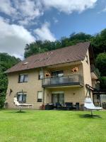 a house with a large yard with a balcony at Haus Am Burghain in Naumburg