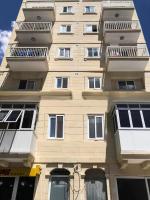 a tall building with balconies on the side of it at F11 Room 1, Private double room with private bathroom in shared Flat in Msida