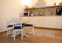 A kitchen or kitchenette at ARTEMIDE "Arco Antico" B&B SUITE SPA
