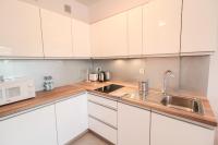 Kuchyňa alebo kuchynka v ubytovaní Apartamenty City Center - Zdrojowe
