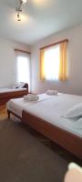Postel nebo postele na pokoji v ubytování Apartments Villa Anna