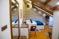 Postel nebo postele na pokoji v ubytování Oblivion Luxury Rooms