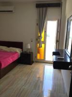 Postel nebo postele na pokoji v ubytování Lady Queen Apartment