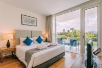 Postel nebo postele na pokoji v ubytování Splash Beach Resort, Maikhao Phuket - SHA Extra Plus