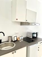 Kuchyňa alebo kuchynka v ubytovaní Apartamentos - Alameda