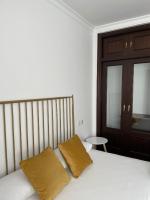 Posteľ alebo postele v izbe v ubytovaní Apartamentos - Alameda