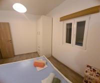 Posteľ alebo postele v izbe v ubytovaní Apartman SPOT