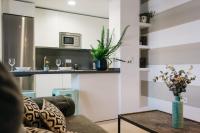 Kuchyň nebo kuchyňský kout v ubytování Encarnación Suite Apartment
