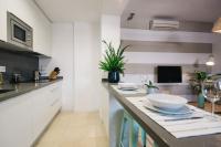 Kuchyň nebo kuchyňský kout v ubytování Encarnación Suite Apartment