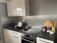 a kitchen with a stove and a counter top at Hostel Little Quarter in Prague