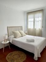 Posteľ alebo postele v izbe v ubytovaní Apartamentos - Alameda
