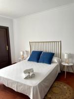 Posteľ alebo postele v izbe v ubytovaní Apartamentos - Alameda
