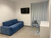 Televízia a/alebo spoločenská miestnosť v ubytovaní Torre del mare Rooms