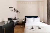 A bed or beds in a room at Zola Hotel - Palais de Bohème Adults Only