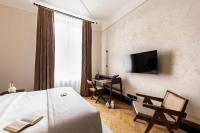 A television and/or entertainment centre at Zola Hotel - Palais de Bohème Adults Only