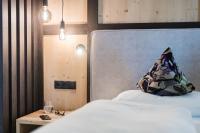 Posteľ alebo postele v izbe v ubytovaní myLoisl Apartments
