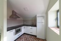 Kuchyň nebo kuchyňský kout v ubytování Apartamentos Rurales La Gloria de Yuste