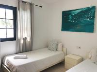 Postel nebo postele na pokoji v ubytování Villa el Roque