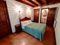 Postel nebo postele na pokoji v ubytování Apartamentos Rurales La Tablá