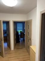 a kitchen and dining room with two doors and a table at W apartmán 2 in Teplice nad Metují